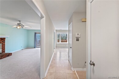 Corridor with light colored carpet