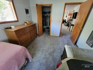 Bedroom featuring carpet floors and a walk in closet