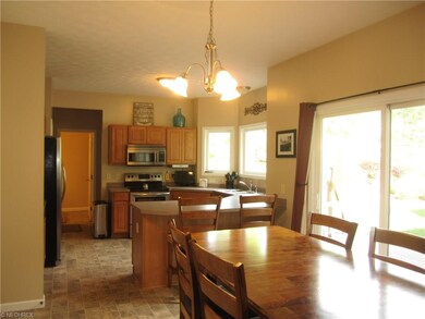 Garage entry, laundry and half bath beyond far doo