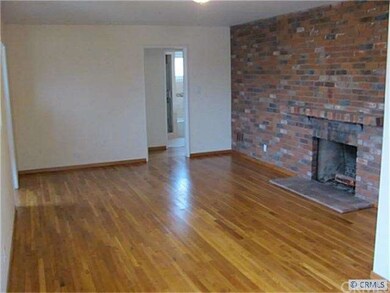 Living room also has wall to wall brick fireplace