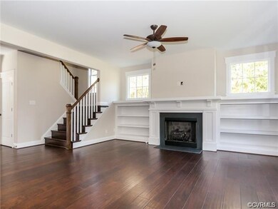 family room with gas fireplace and built ins