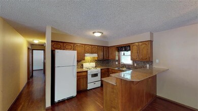 UPDATED KITCHEN W/GRANITE COUNTERS & TILE BACKSPLA