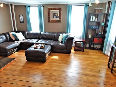 Another view of the living room and the many windo