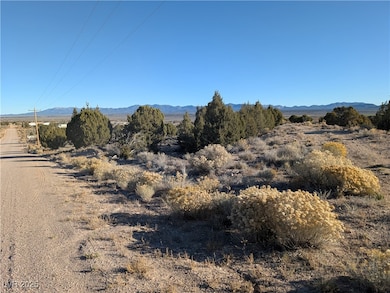 View of mountain backdrop with rural landscape
