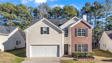 Traditional home with driveway, an attached garage