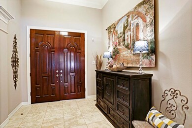 View of the large entry foyer which features Travertine stone floor.