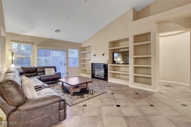 Living room with built in features, baseboards, a