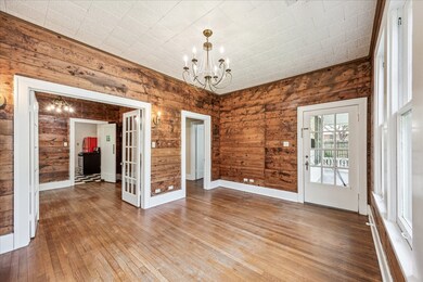 View of the living room showing the glass paneled