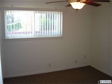 One of Two Bedrooms with Ceiling Fans