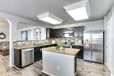 Kitchen featuring appliances with stainless steel
