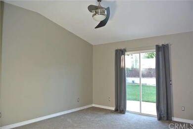 Master bedroom with ceiling fan, cathedral ceiling