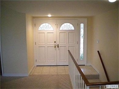 Gracious foyer with double door entry.