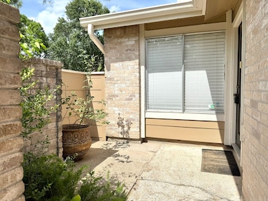 The home welcomes with a small front patio