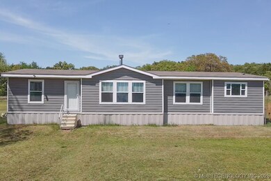 Manufactured / mobile home with entry steps and a