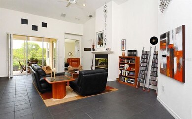 Great room with vaulted ceilings and a gas firepla