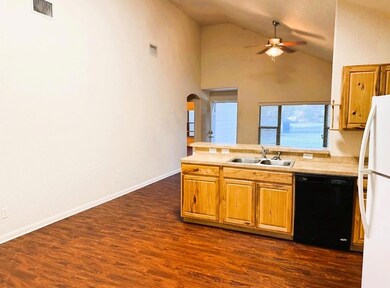 Kitchen featuring freestanding refrigerator, blac