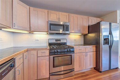 Stainless steel appliances including a gas range.