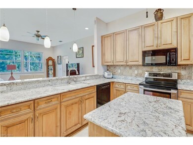 Kitchen with granite counters, tile backsplash and