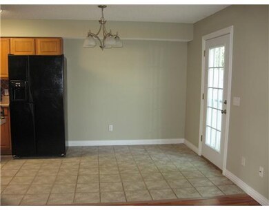 Dining Room. Eat-in kitchen dining area. Patio door has storm door and accesses privacy fenced backyard.
