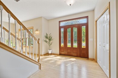 A bright, spacious foyer welcomes you inside this lovely home.