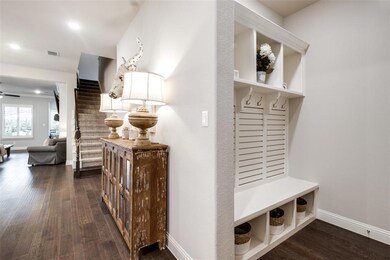 Entrance from 3 car garage with convenient storage