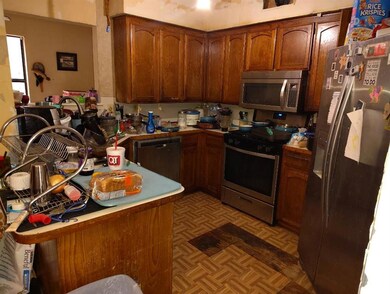 Kitchen with light parquet flooring, appliances wi