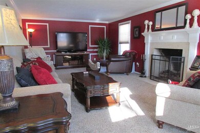 Features Gas Fireplace, Crown Molding and Wainscot