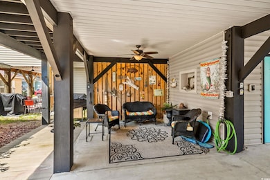 View of patio / terrace with grilling area and ceiling fan