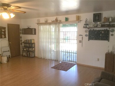 Two sets of sliders open from family room out to back yard.