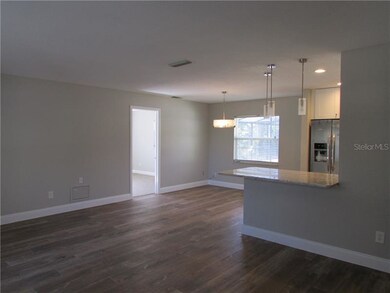 Living room view to dining area and breakfast bar