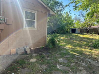 View of home's exterior with a storage shed and a 