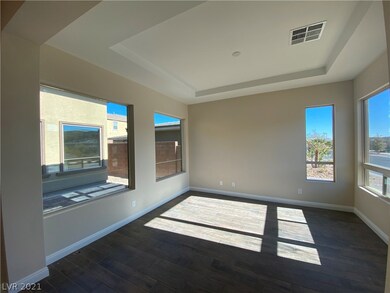 Den (13x13) with view of side courtyard