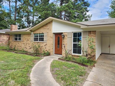Ranch-style house with a front yard