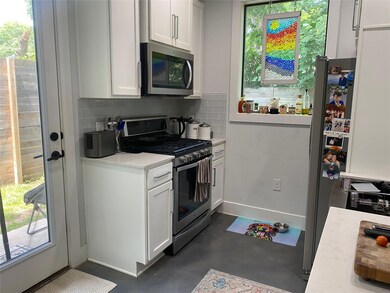 Kitchen featuring appliances with stainless steel