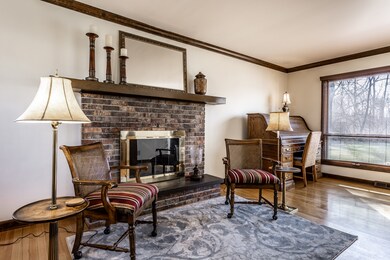 Enjoy the easy and ambiance of a gas log fireplace with classic brick surround.