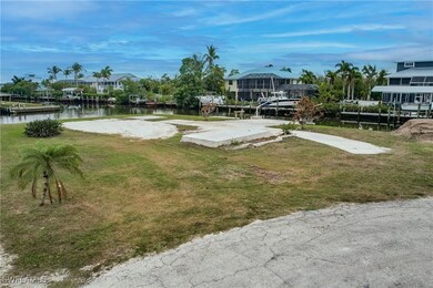 View of property's community featuring a lawn and a water view