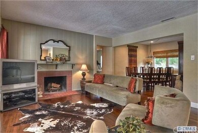 Your living room with cozy fireplace, joins the fo
