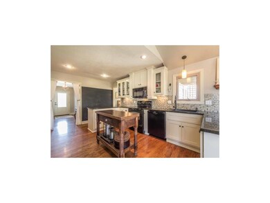 Kitchen and large chalk board wall.