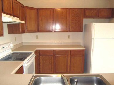 Kitchen includes refrigerator and pantry.