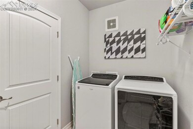Washroom with washing machine and dryer