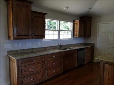 Kitchen with custom oak raised panel cabinets and granite counter tops