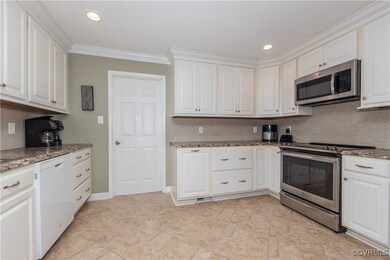 Bright Kitchen with Tile Floor and Plentiful Cabin