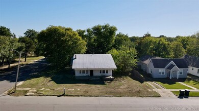 FRONT VIEW WITH LARGE COVERED PORCH