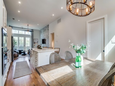 Dining area with recessed lighting, visible vents,