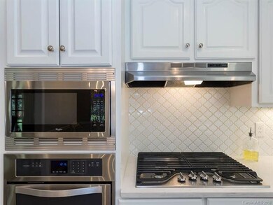 Gas cooktop set in white quartz countertop