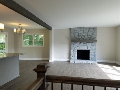 GREAT ROOM OPEN TO KITCHEN AND DINING AREA