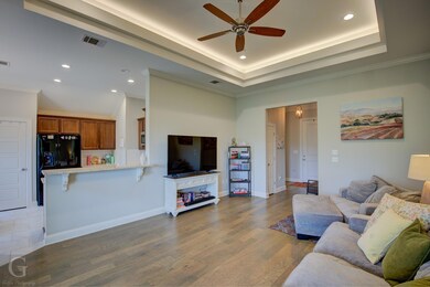 Tiled living room featuring ornamental molding, ce