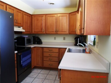 Updated kitchen with ceramic tile flooring.