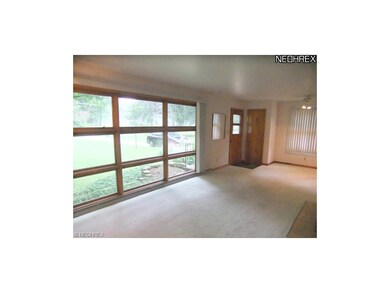 The foyer welcomes you into the living room that f