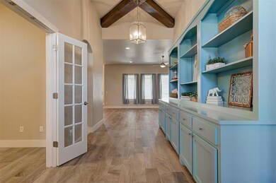 Wide entry and french doors into the private offic